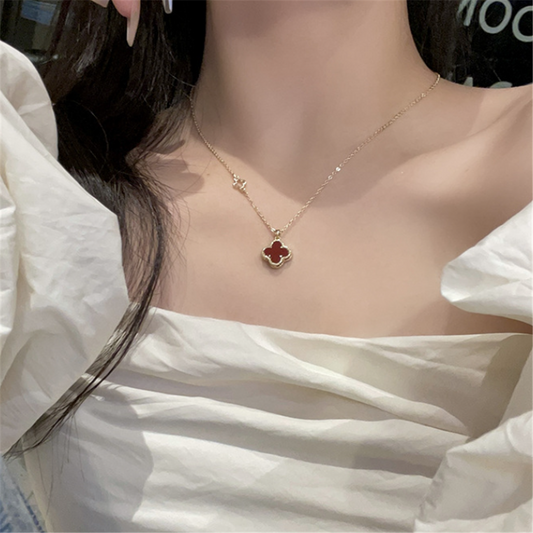 woman wearing a gold pendant necklace in a cozy Christmas setting